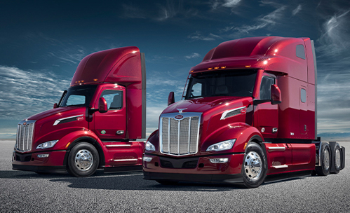 two red peterbilt trucks